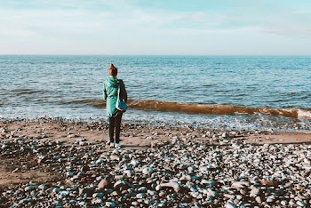 Woman Wearing Jacket Standing by the Sea