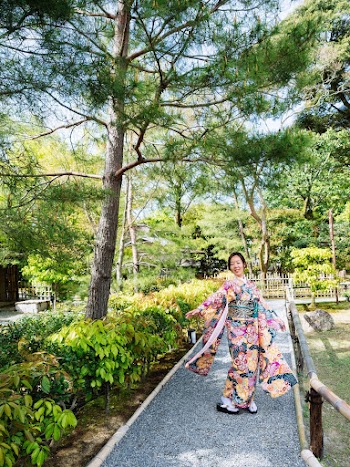 Woman Wearing Kimono Dress Standing on Pathway