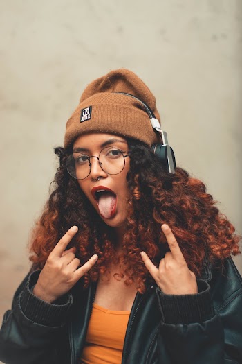 Woman Wearing Leather Jacket With Tongue Out