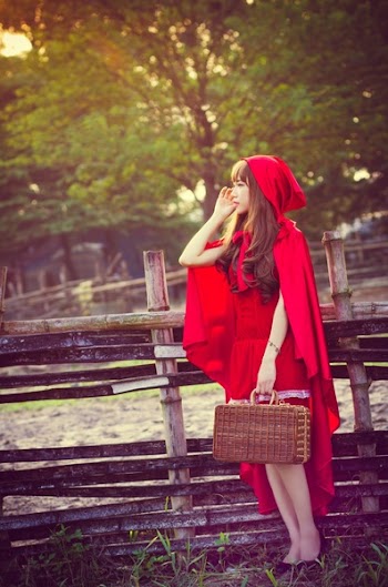 Woman Wearing Little Red Riding Hood Costume