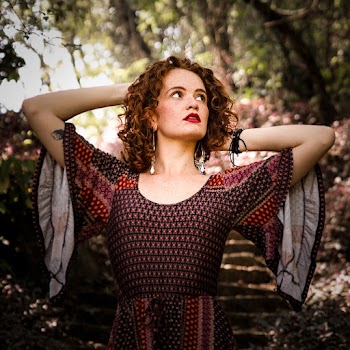 Woman Wearing Maroon and Gray Wingbat Dress