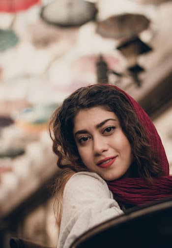 Woman Wearing Maroon Headscarf