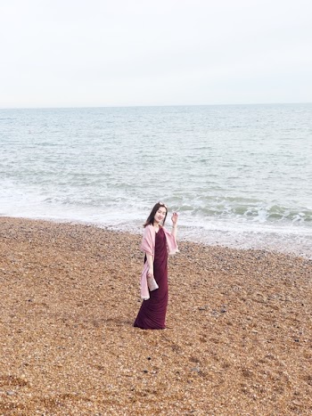 Woman Wearing Maroon Long Dress Near Seashore