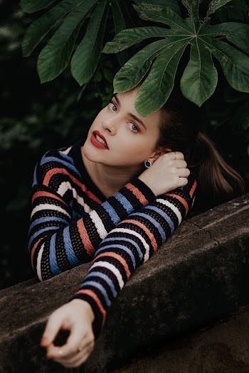 Woman Wearing Multi-coloured Striped Crew Neck Long Sleeved Shirt Near Green Leaf Plant