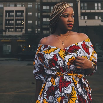 Woman Wearing Multicolored Floral Off-shoulder Dress