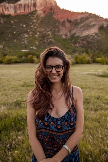 Woman Wearing Multicolored Spaghetti Strap Dress Standing Near Green Grass at Daytime