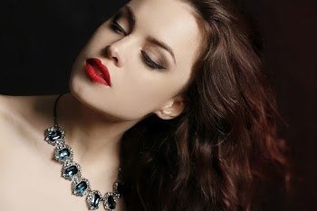 Woman Wearing Necklace and Red Lipstick