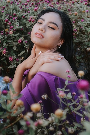 Woman Wearing Off-shoulder Top Surrounded by Flowers