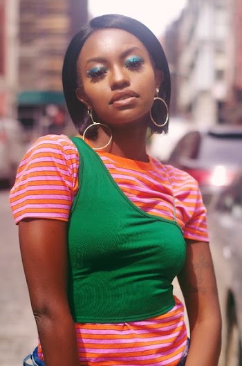 Woman Wearing Orange and Green Shirt
