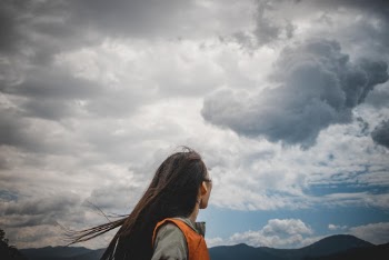 Woman Wearing Orange and Grey Top