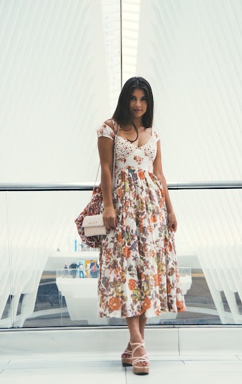 Woman Wearing Orange and White Floral V-neck Cap-sleeved Maxi Dress