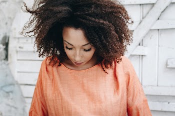 Woman Wearing Orange Boat-neck Top