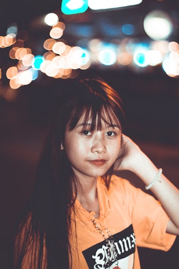 Woman Wearing Orange Crew-neck Top
