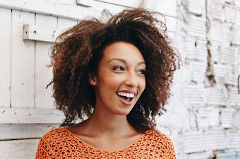 Woman Wearing Orange Knitted Top