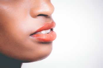 Woman Wearing Orange Lipstick