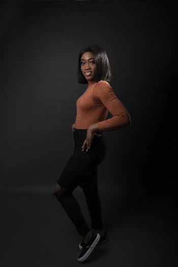 Woman Wearing Orange Long-sleeved Shirt and Black Jeans