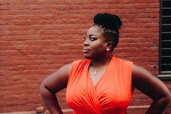 Woman Wearing Orange Sleeveless Top