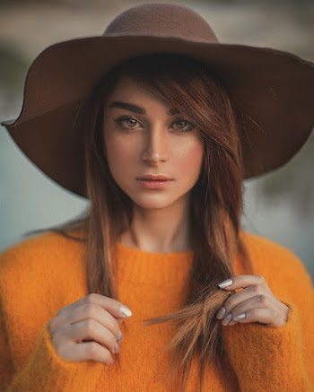 Woman Wearing Orange Sweater