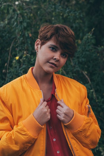 Woman Wearing Orange Zip-up Jacket