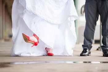 Woman Wearing Pair of Red Pointed-toe Heeled Sandals