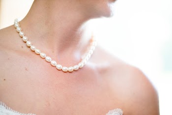 Woman Wearing Pearl Necklace