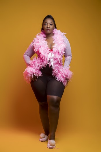 Woman Wearing Pink-and-black Long-sleeved Shirt and Shorts Outfit