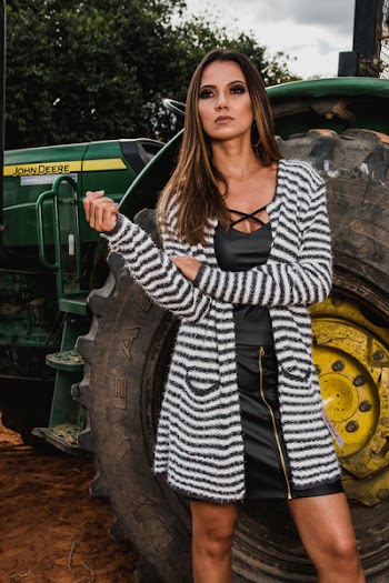 Woman Wearing Pink and Black Striped Long Cardigan Standing Behind John Deere Tractor at Daytim E