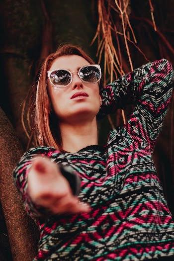 Woman Wearing Pink and Blue Sweater