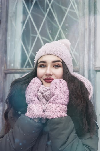 Woman Wearing Pink Gloves, Gray Parka Jacket, and Pink Knit Hat