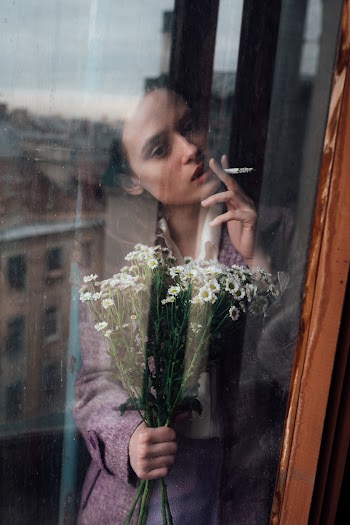 Woman Wearing Pink Long Sleeve Shirt Holding White Flowers