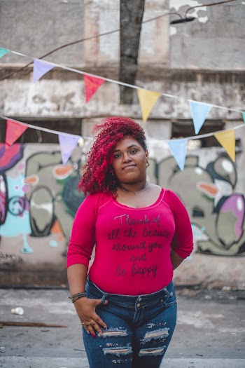 Woman Wearing Pink Long-sleeved Shirt and Distressed Jeans