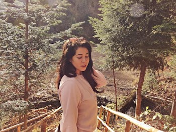 Woman Wearing Pink Long-sleeved Shirt on Wooden Bridge