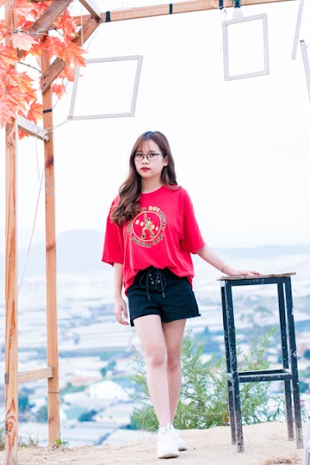 Woman Wearing Pink Scoop-neck Top and Black Shorts