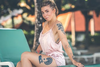 Woman Wearing Pink Spaghetti-strap Rompers