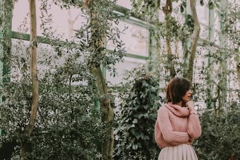 woman wearing pink sweater