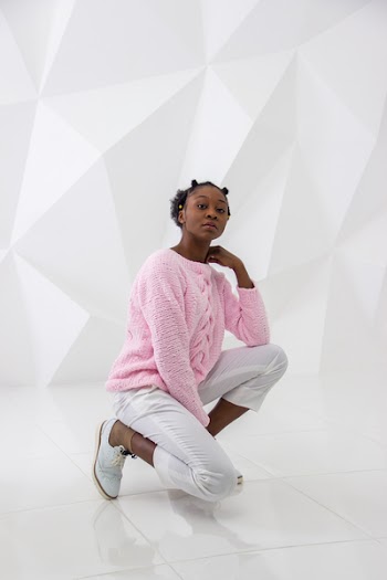 Woman Wearing Pink Sweater and White Pants Posing