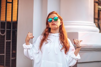 Woman Wearing Pullover Hoodie And Sunglasses 