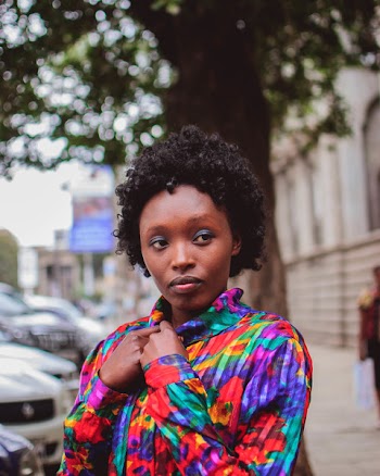 Woman Wearing Purple and Green Button-up Long-sleeved Top