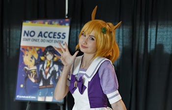 Woman Wearing Purple and White Costume Near Green Curtain