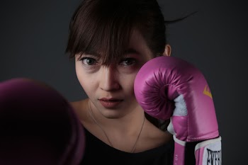 Woman Wearing Purple Boxing Gloves