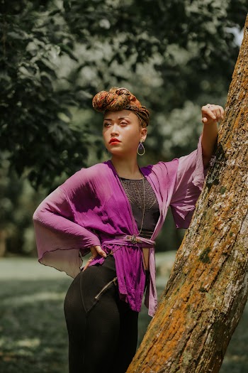 Woman Wearing Purple Dress Standing in Front of Tree