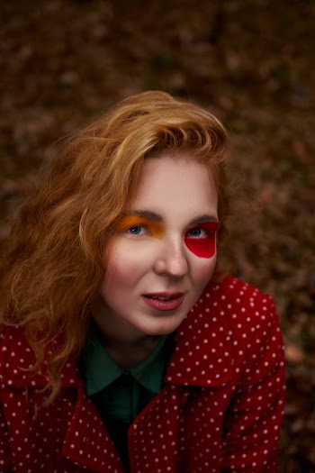 Woman Wearing Red and Beige Top