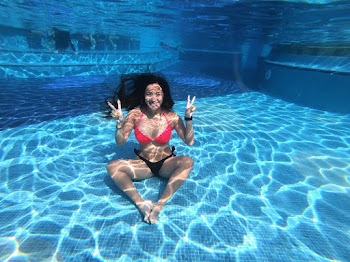 Woman Wearing Red and Black Bikini Under Pool