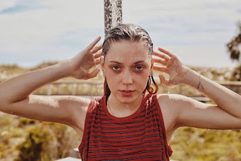 Woman Wearing Red and Black Striped Top