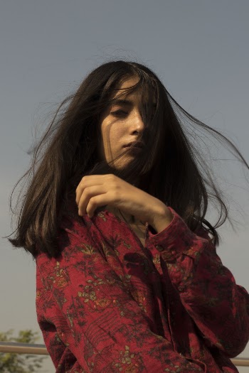 Woman Wearing Red and  Floral Top