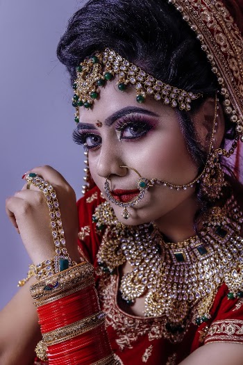Woman Wearing Red and Gold-colored Accessories