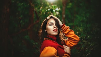 Woman Wearing Red and Orange Letterman's Jacket