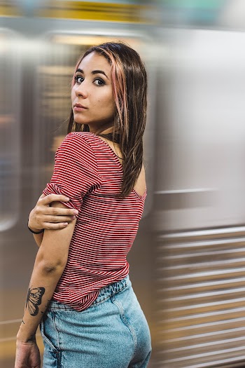 Woman Wearing Red And White Stripe T-shirt And Blue Denim Jeans