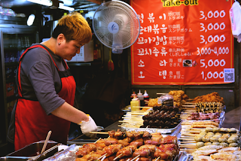 Woman Wearing Red Apron Preparing Food