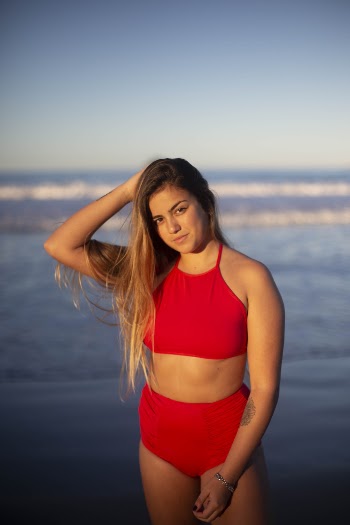 Woman Wearing Red Bikini Standing On Shore